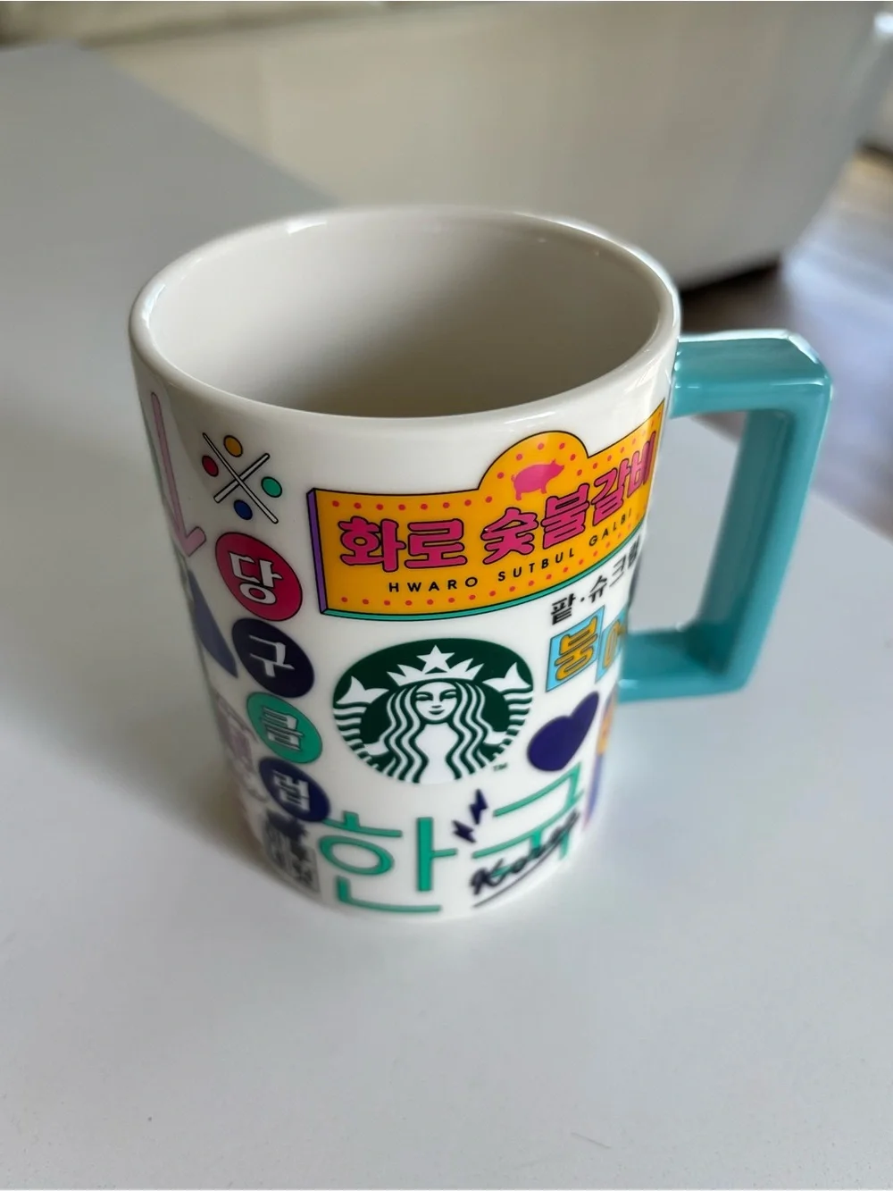 Starbucks White Mug with Teal Handle and Hangeul Sticker Graphics from Korea